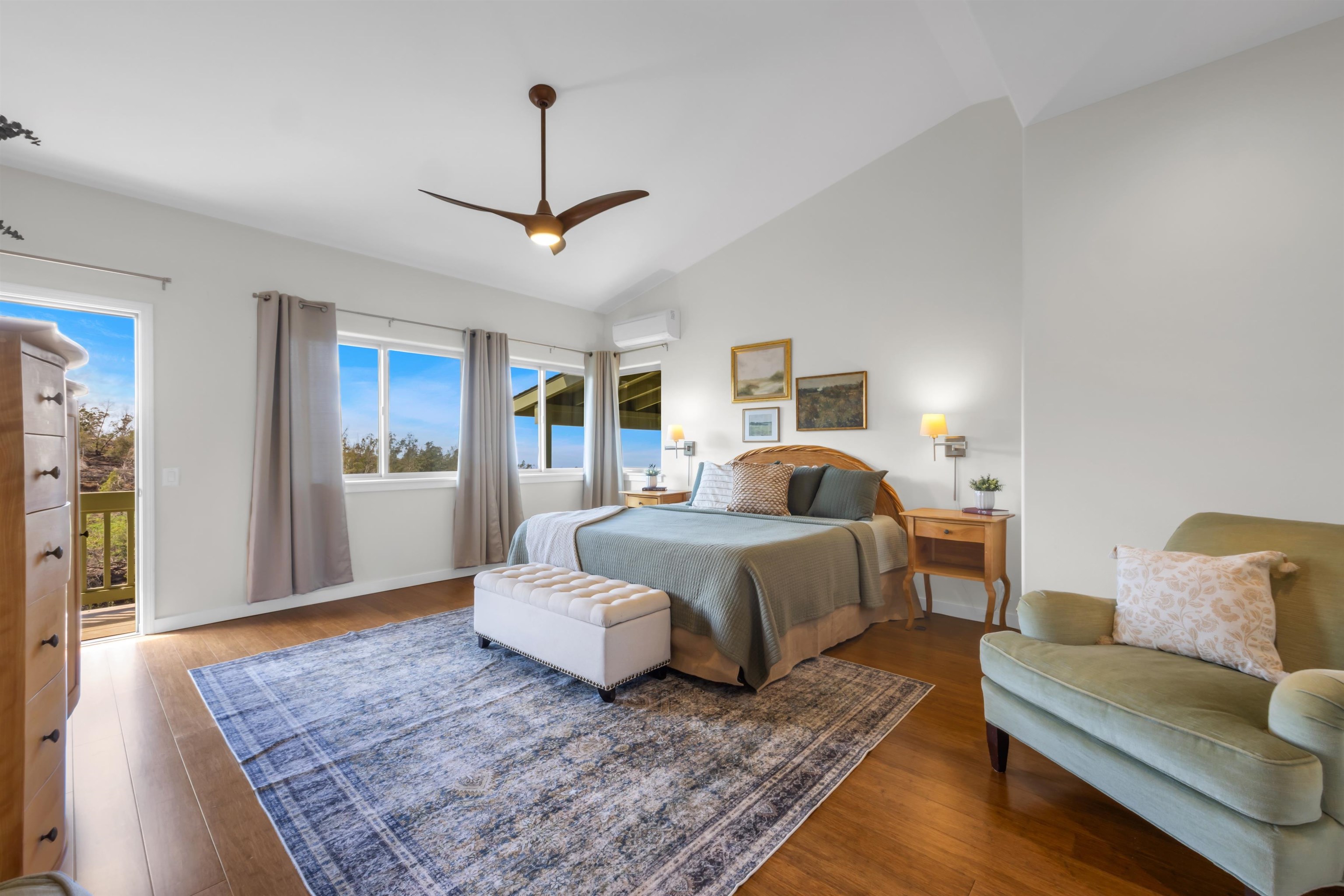 183 Kulamanu Circle Kula, HI 96790 - Photo 16 of 42 a spacious bedroom with a bed a couch and a dresser