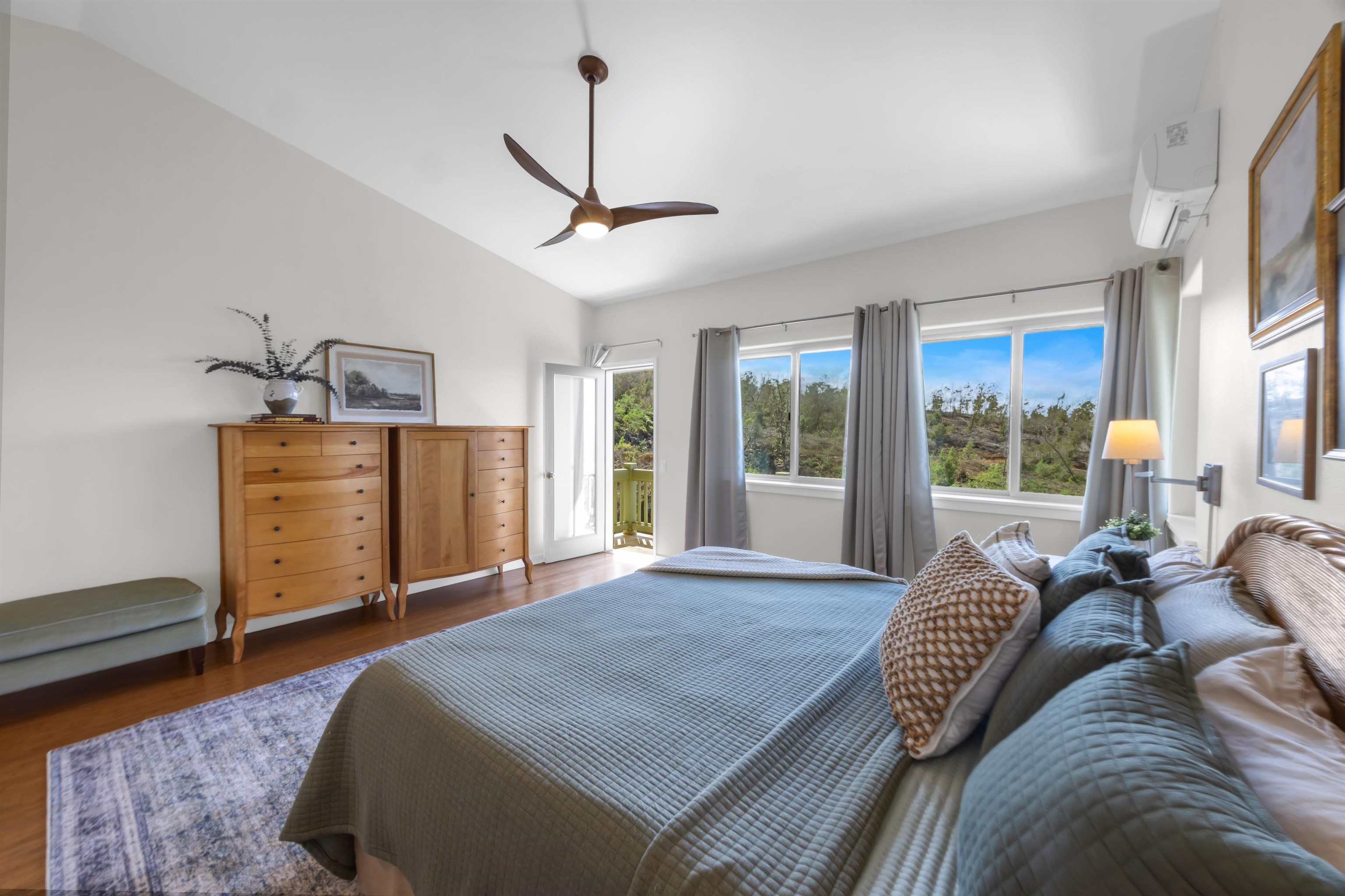 183 Kulamanu Circle Kula, HI 96790 - Photo 17 of 42 a spacious bedroom with a bed a window and a couch