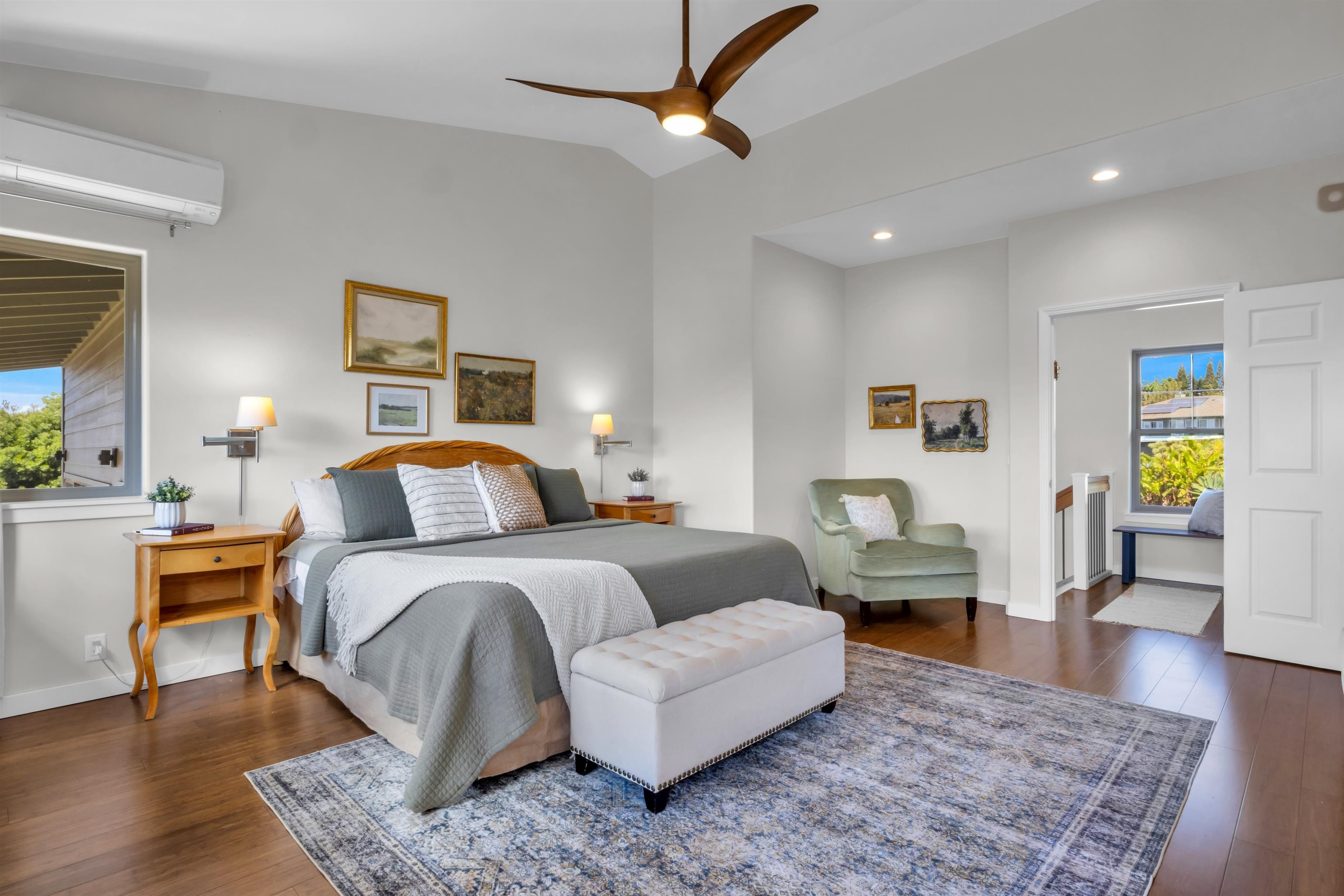 183 Kulamanu Circle Kula, HI 96790 - Photo 18 of 42 a bedroom with a bed lamps and wooden floor