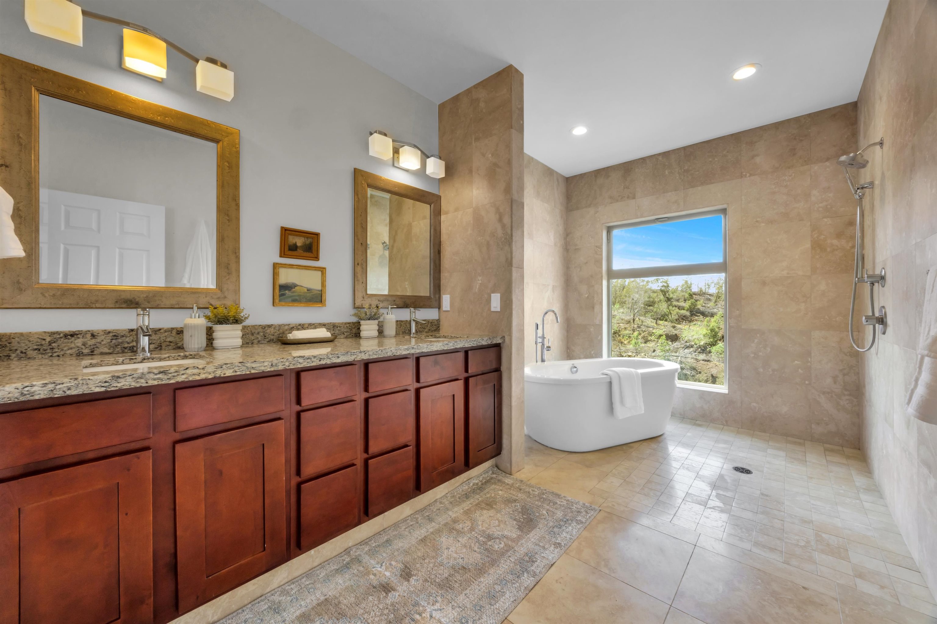 183 Kulamanu Circle Kula, HI 96790 - Photo 20 of 42 a bathroom with a granite countertop sink mirror and bathtub