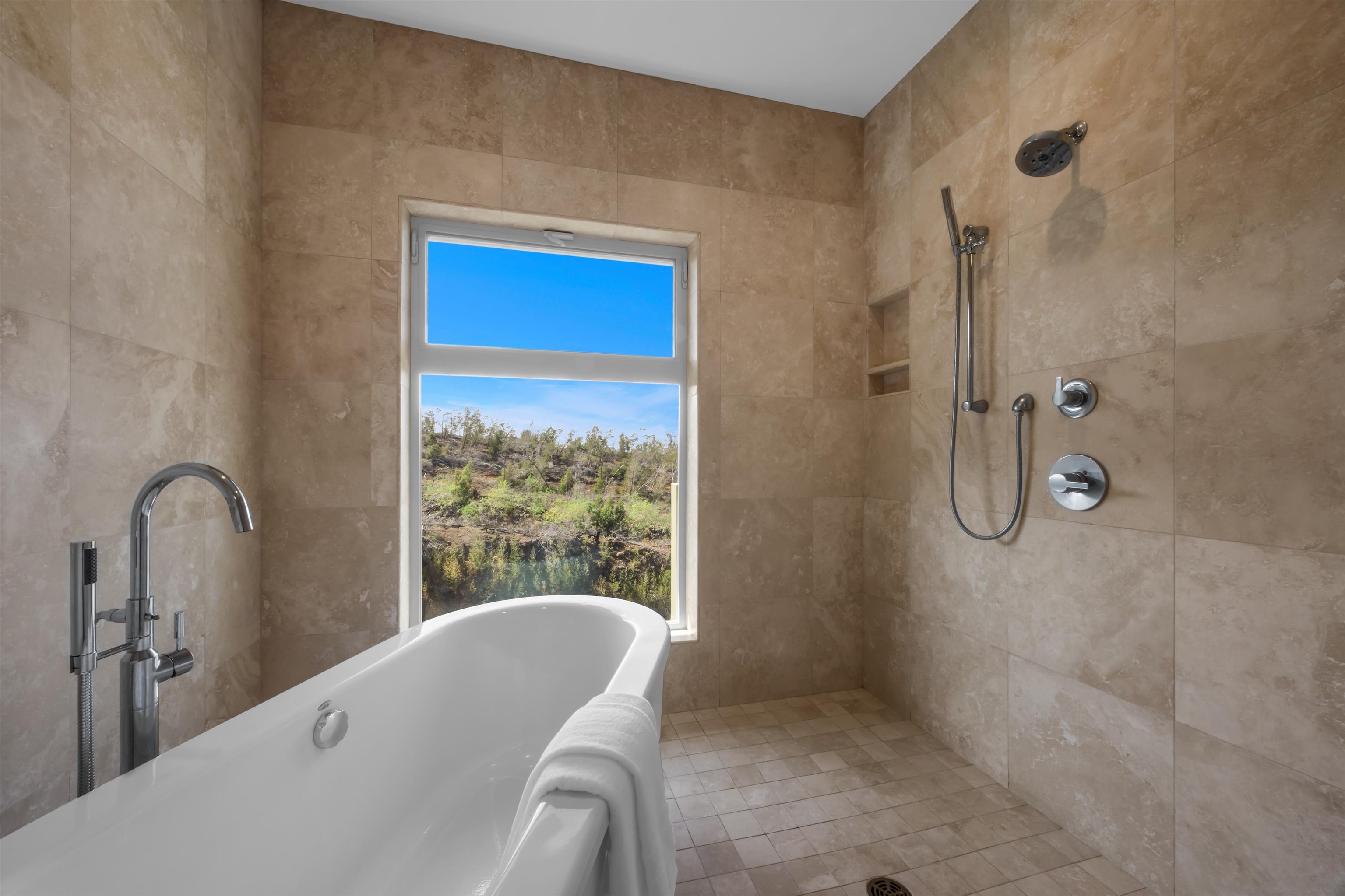 183 Kulamanu Circle Kula, HI 96790 - Photo 22 of 42 a bathroom with a tub shower and window