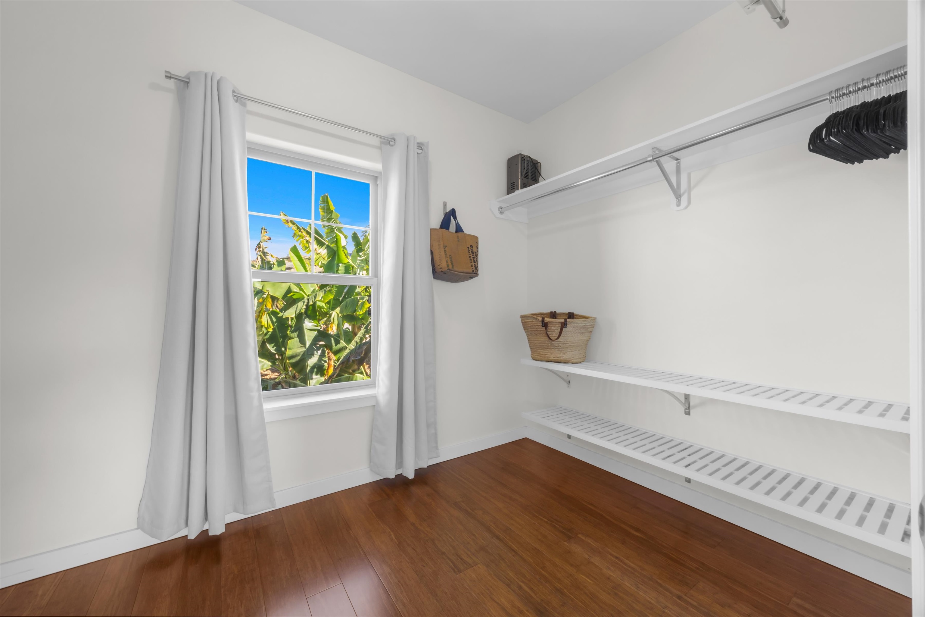 183 Kulamanu Circle Kula, HI 96790 - Photo 24 of 42 a view of walk in closet with wooden floor