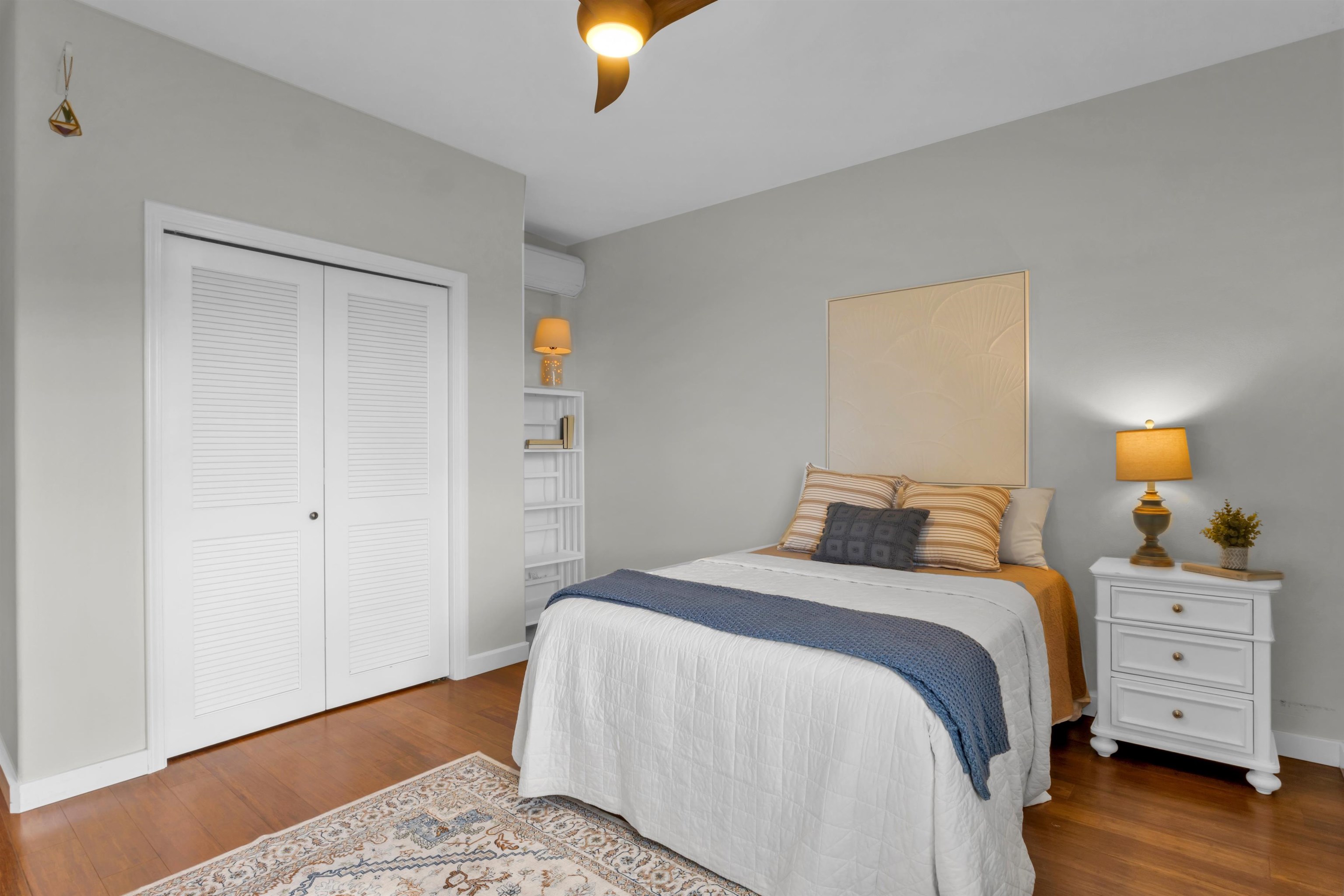 183 Kulamanu Circle Kula, HI 96790 - Photo 30 of 42 a bedroom with a bed and wooden floor