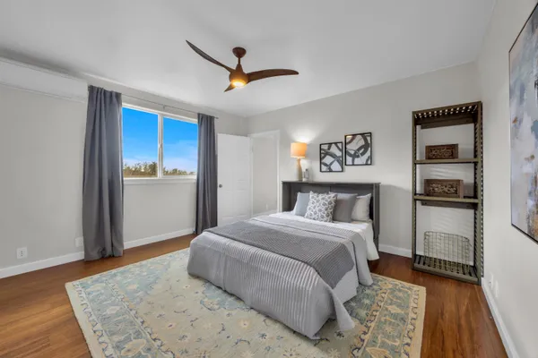 a bedroom with a bed and a dresser