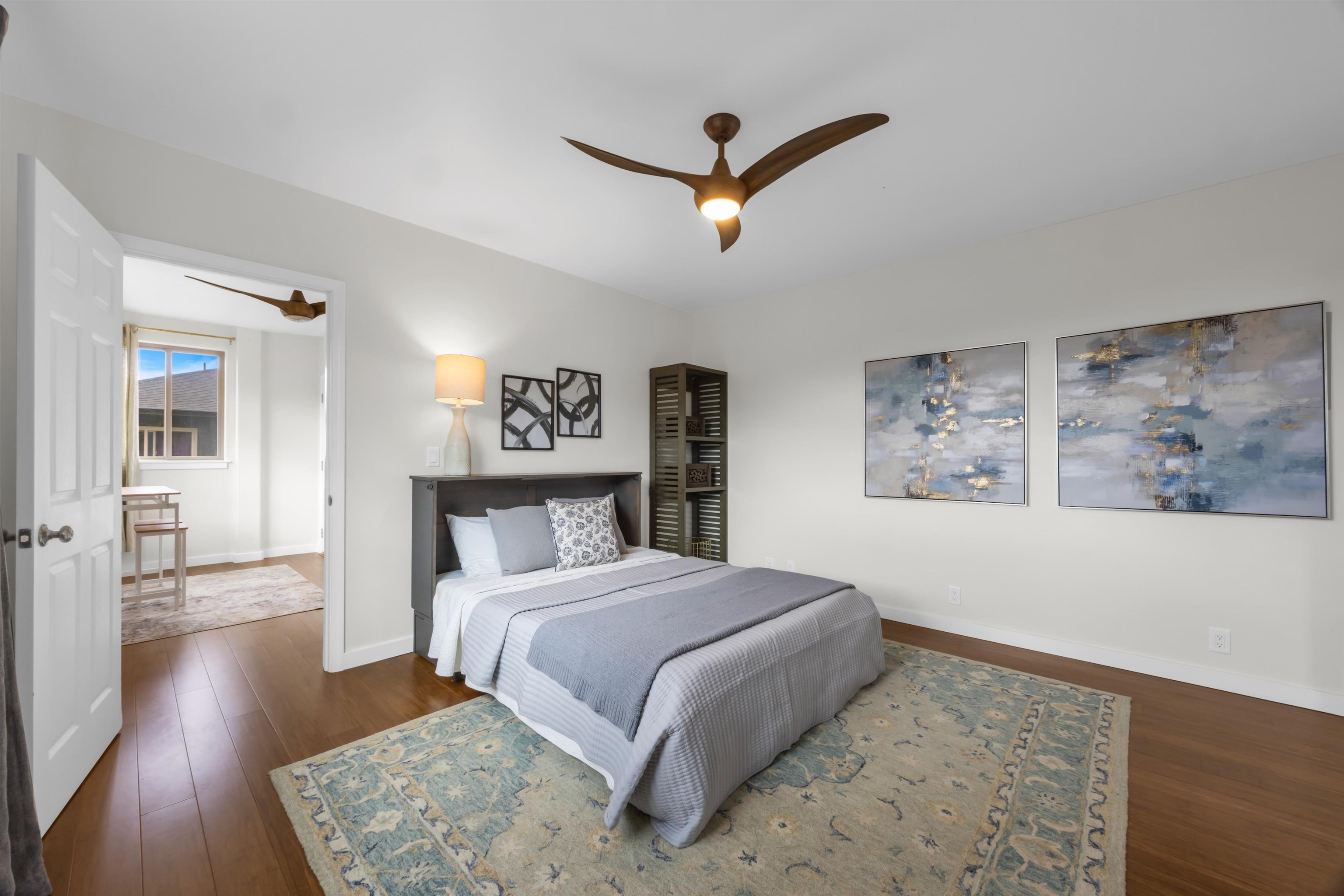 183 Kulamanu Circle Kula, HI 96790 - Photo 34 of 42 a bedroom with a large bed and a painting on the wall