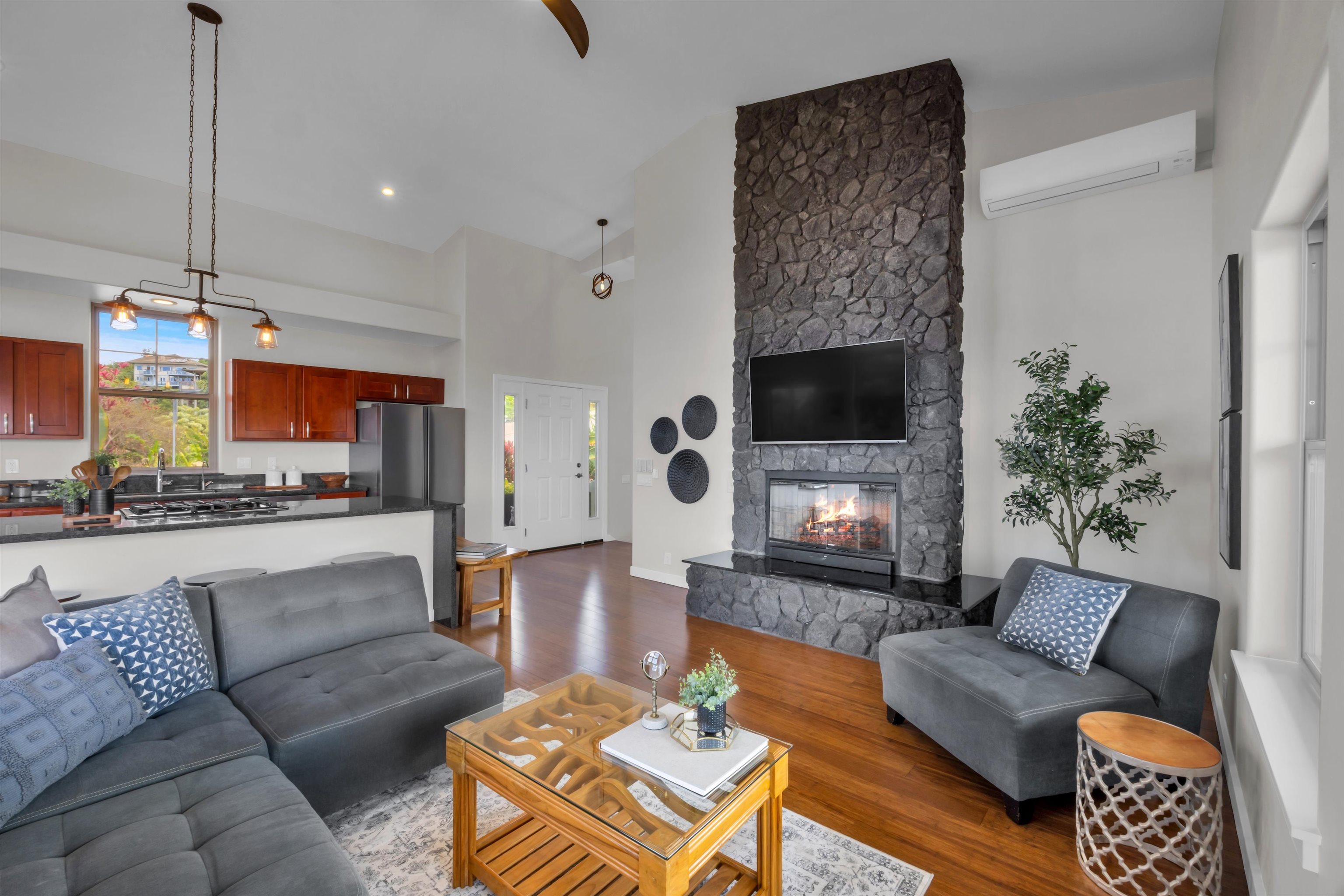 183 Kulamanu Circle Kula, HI 96790 - Photo 5 of 42 a living room with furniture and a fireplace