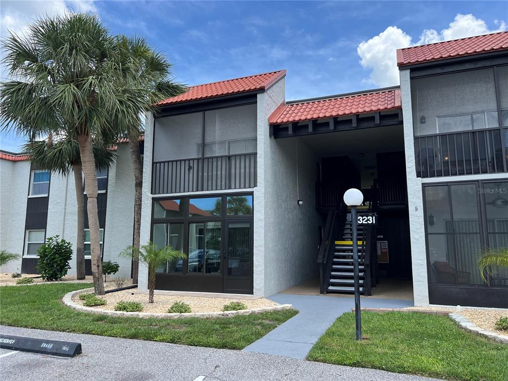 3231 South Beneva Road, Unit 202 Sarasota, FL 34232 - Photo 1 of 1 a front view of a house with garden