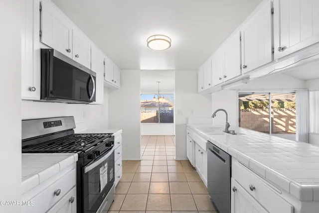 a view of kitchen with wooden floor