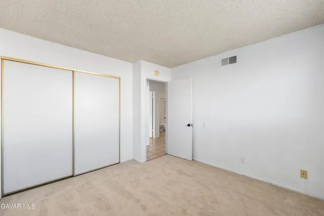 a view of a room with wooden walls