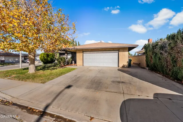 a view of a house with a tree