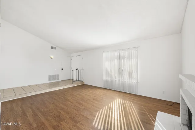 a view of an empty room and window