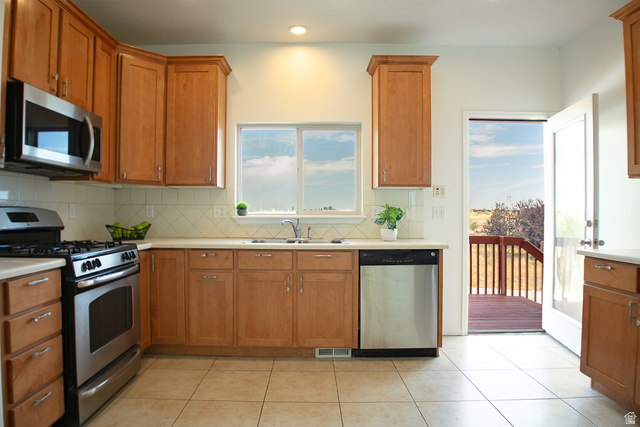 3365 Falcon Way Layton, UT 84040 - Photo 3 of 27 Kitchen with walkout to Deck