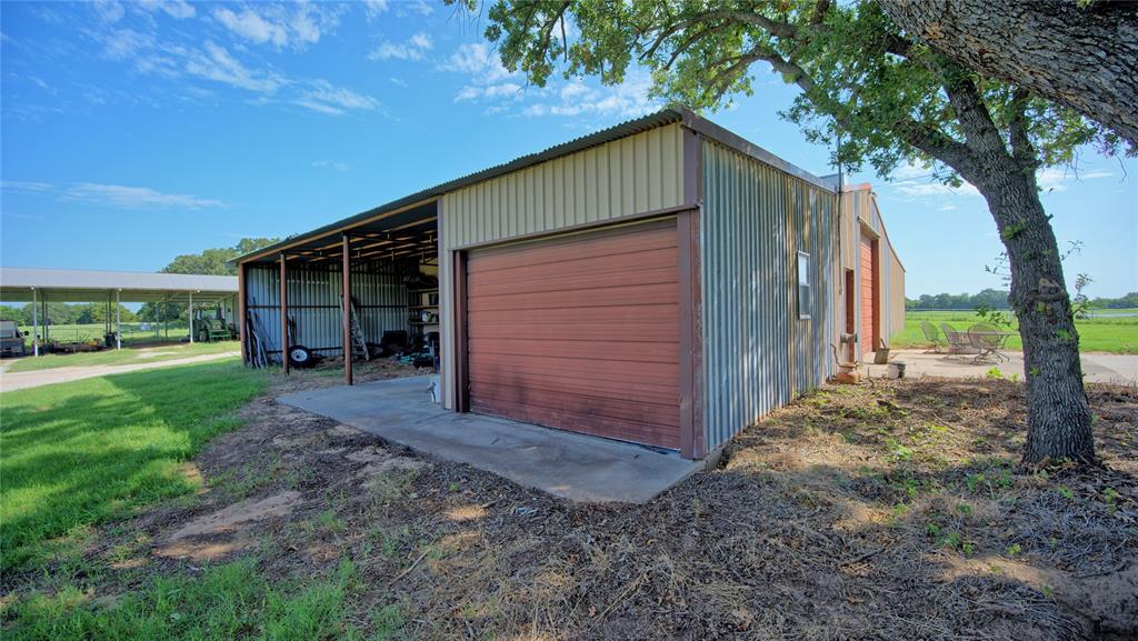 8752 Fm 1749 Sunset, TX 76270 - Photo 18 of 40 a front view of house with a garden