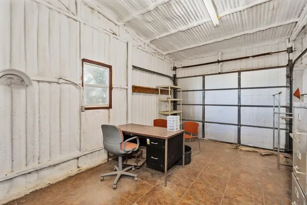 a room with furniture a rug and a window