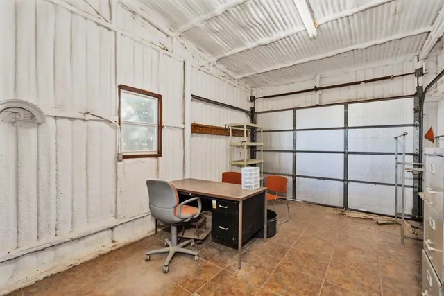 a room with furniture a rug and a window