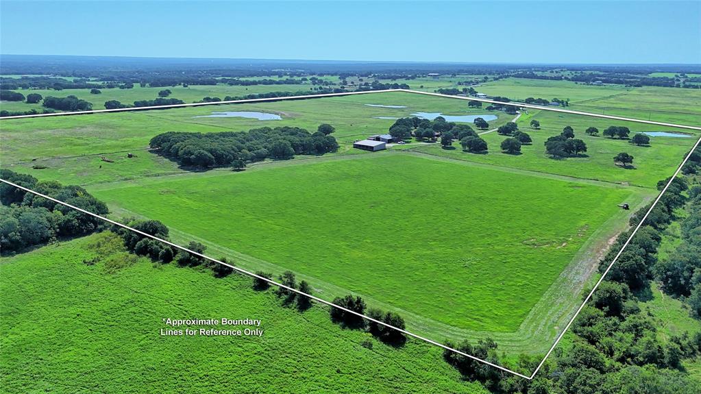 8752 Fm 1749 Sunset, TX 76270 - Photo 2 of 40 a view of a golf ground with a large trees