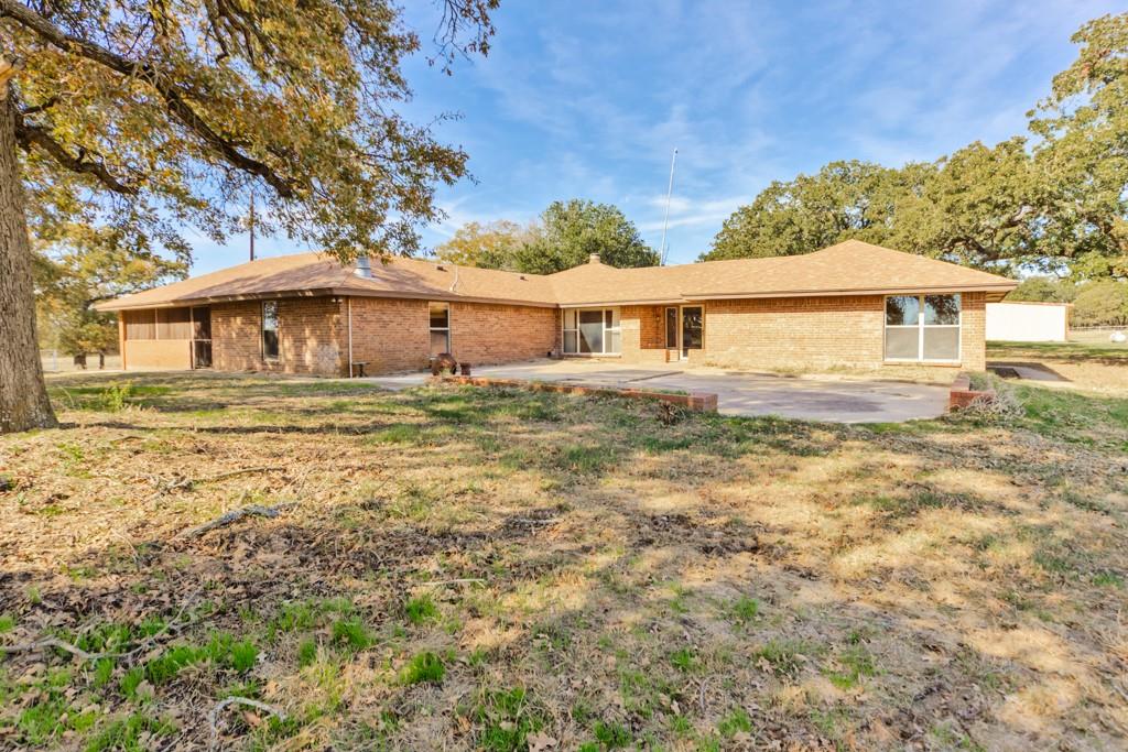 8752 Fm 1749 Sunset, TX 76270 - Photo 22 of 40 front view of house with a yard