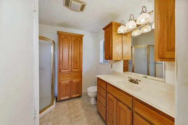 a bathroom with a sink a vanity and a mirror
