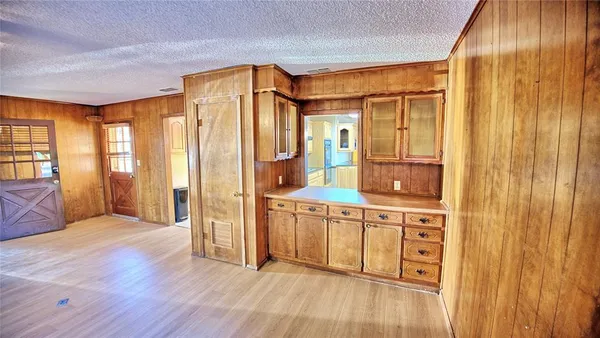 a spacious bathroom with a double vanity sink and a mirror