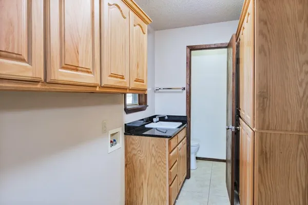 a kitchen with appliances cabinets and a window