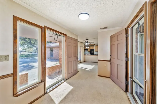 a bathroom with a bathtub and a large window