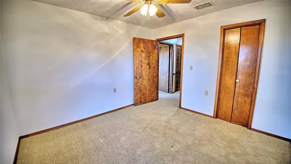 an empty room with a bathroom