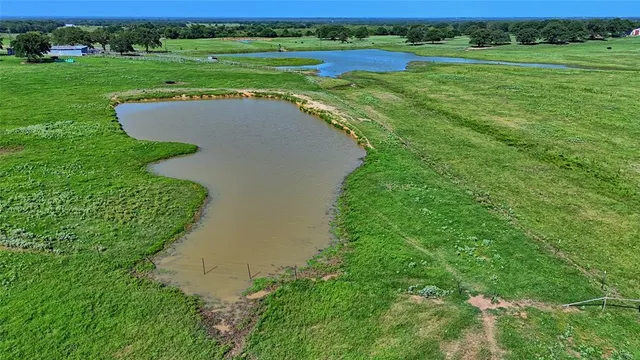 an aerial view of a golf course with a garden