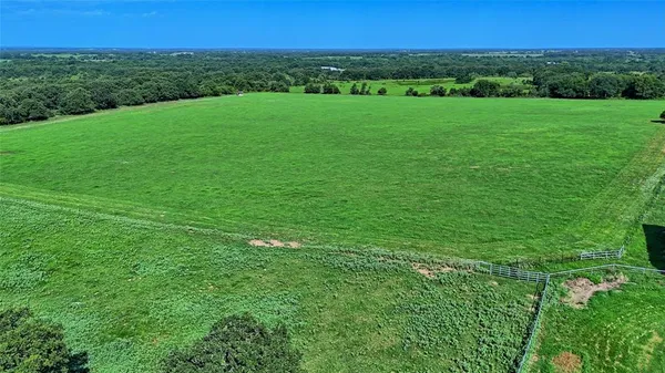 a view of a garden with a building