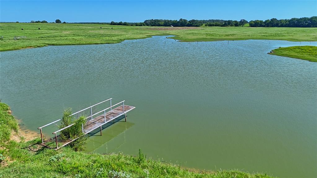 8752 Fm 1749 Sunset, TX 76270 - Photo 10 of 40 a view of a lake with a yard and lake view