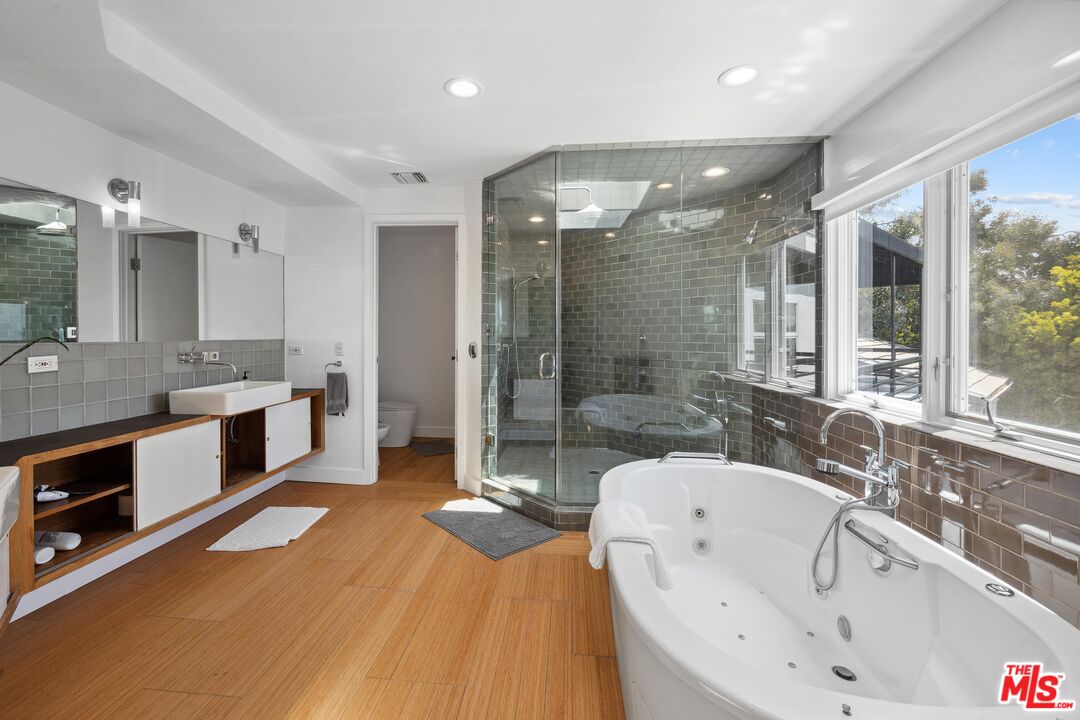 23400 West Moon Shadows Drive Malibu, CA 90265 - Photo 17 of 31 a large bathroom with a large tub and sink