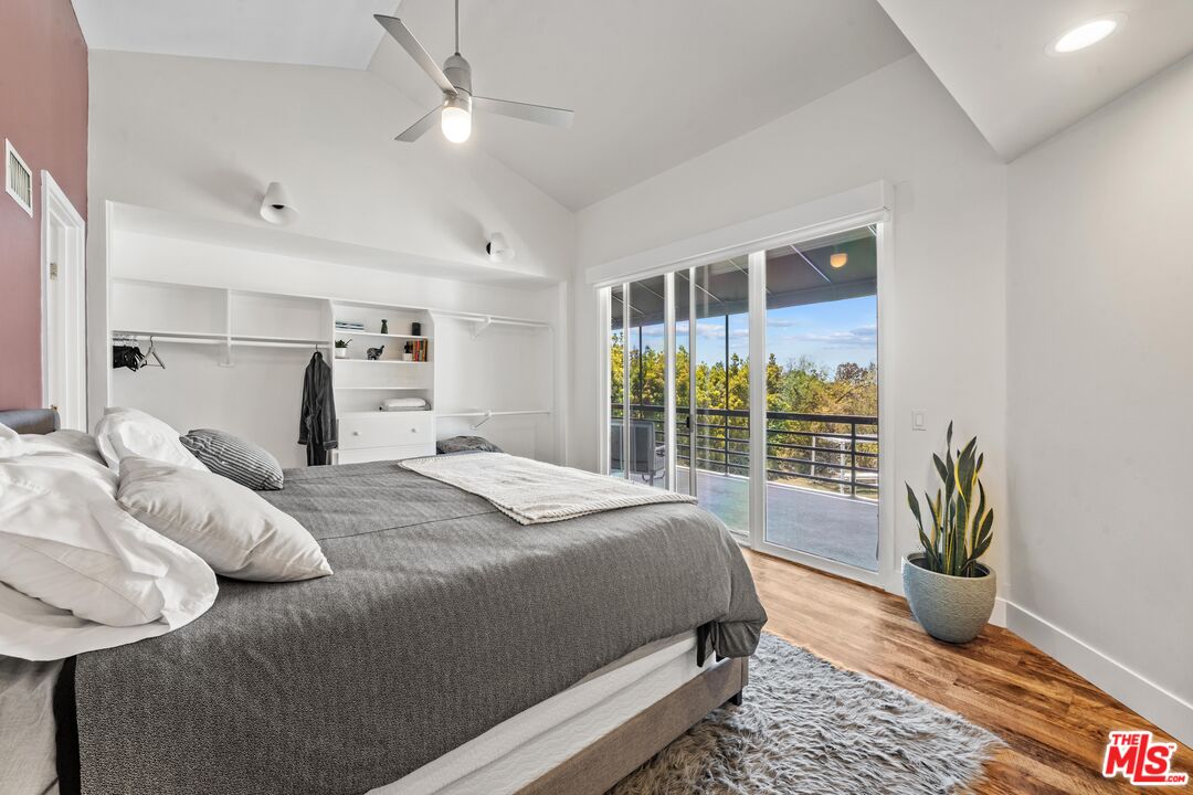 23400 West Moon Shadows Drive Malibu, CA 90265 - Photo 18 of 31 a bedroom with a bed and a potted plant