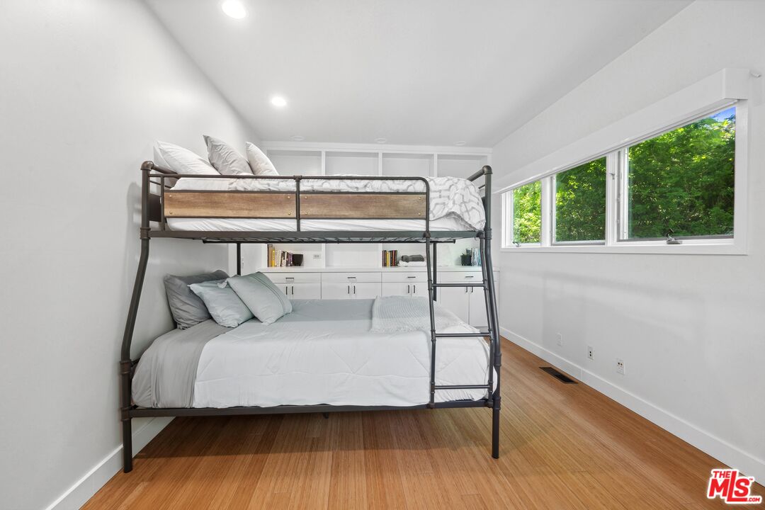 23400 West Moon Shadows Drive Malibu, CA 90265 - Photo 22 of 31 a bedroom with a bed and a window