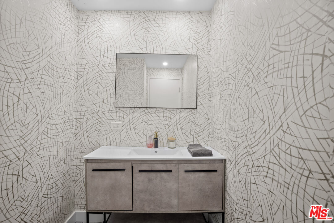 23400 West Moon Shadows Drive Malibu, CA 90265 - Photo 26 of 31 a bathroom with a sink and a mirror