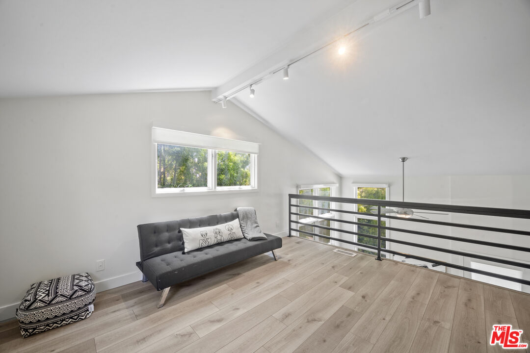 23400 West Moon Shadows Drive Malibu, CA 90265 - Photo 27 of 31 a view of a room with wooden floor and furniture