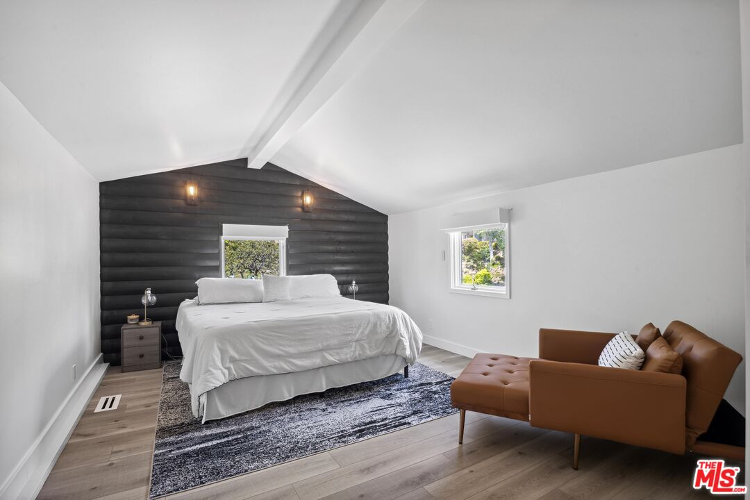 23400 West Moon Shadows Drive Malibu, CA 90265 - Photo 28 of 31 a bedroom with a bed window and couch