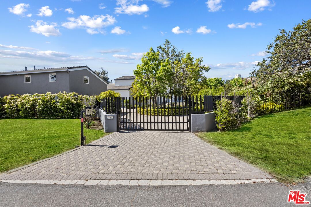 23400 West Moon Shadows Drive Malibu, CA 90265 - Photo 7 of 31 a view of a green yard next to a yard