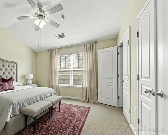 a bedroom that has a bed and a window