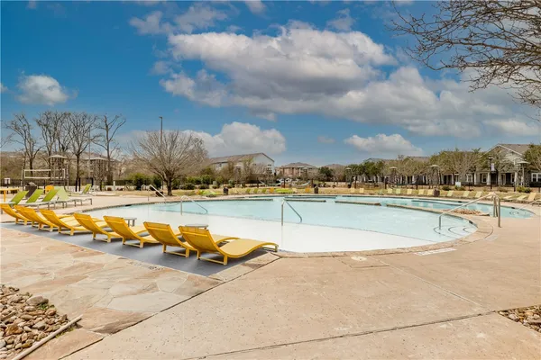 a view of a swimming pool with an ocean view