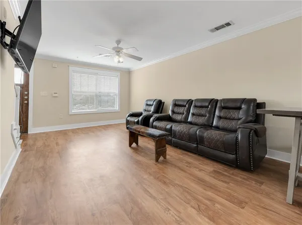 a view of a kitchen with wooden floor