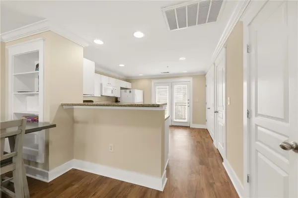 a kitchen with a white cabinets and white appliances