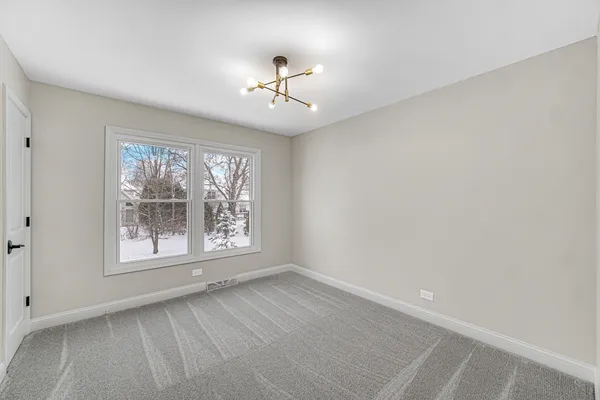 an empty room with large window