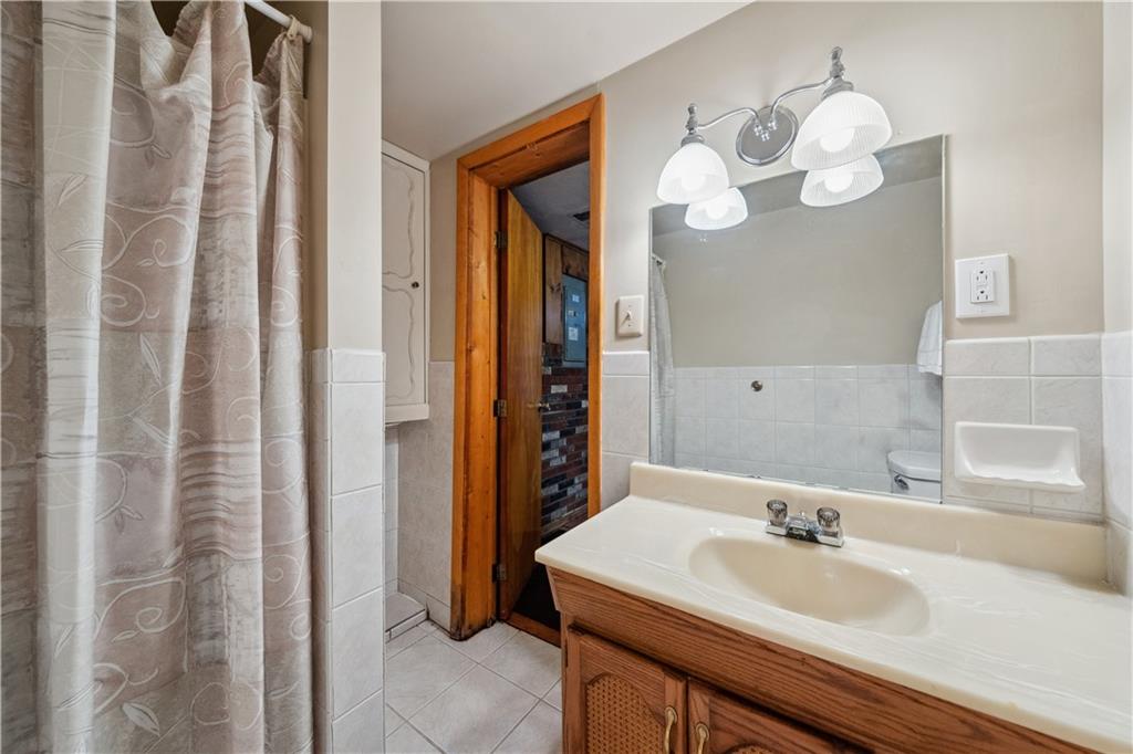 220 County Line Road Bridgeville, PA 15017 - Photo 40 of 50 Lower-Level Bath w/ Toilet, Sink & Shower