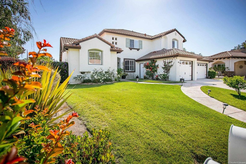 a front view of a house with a yard