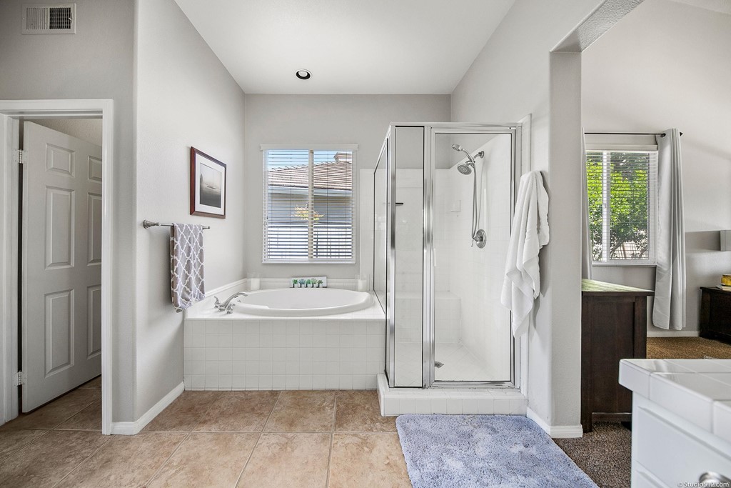 811 Inverlochy Drive Fallbrook, CA 92028 - Photo 17 of 27 a bathroom with a tub shower and sink