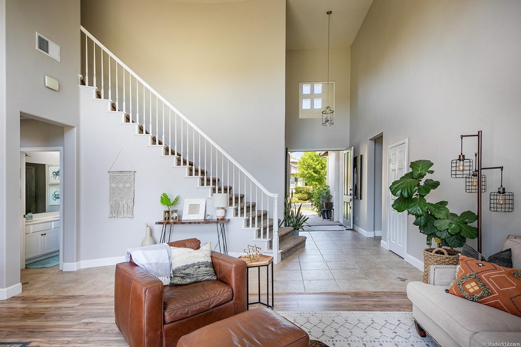 811 Inverlochy Drive Fallbrook, CA 92028 - Photo 4 of 27 a living room with furniture and a stairs