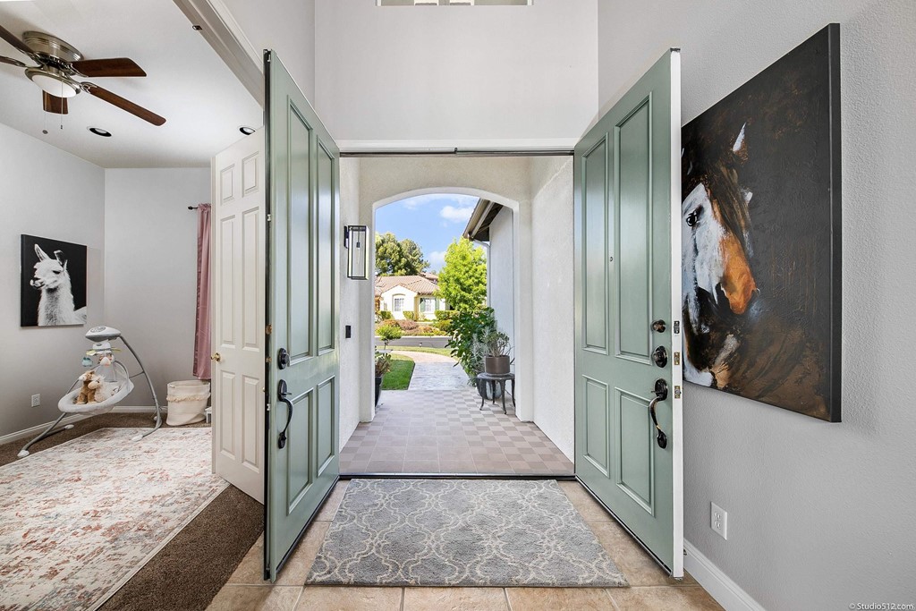 811 Inverlochy Drive Fallbrook, CA 92028 - Photo 7 of 27 a hallway with sliding door and stairs
