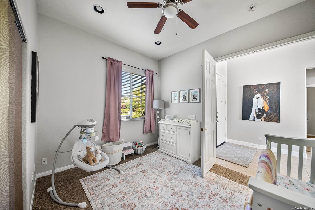 811 Inverlochy Drive Fallbrook, CA 92028 - Photo 8 of 27 a bedroom with furniture and a window