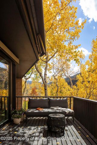 a view of couches with wooden floor