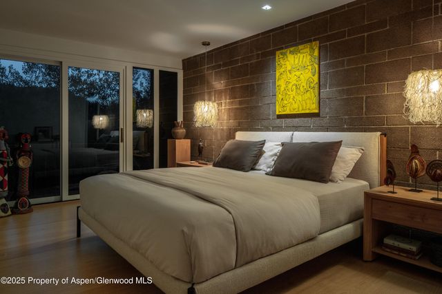 a bedroom with bed and window