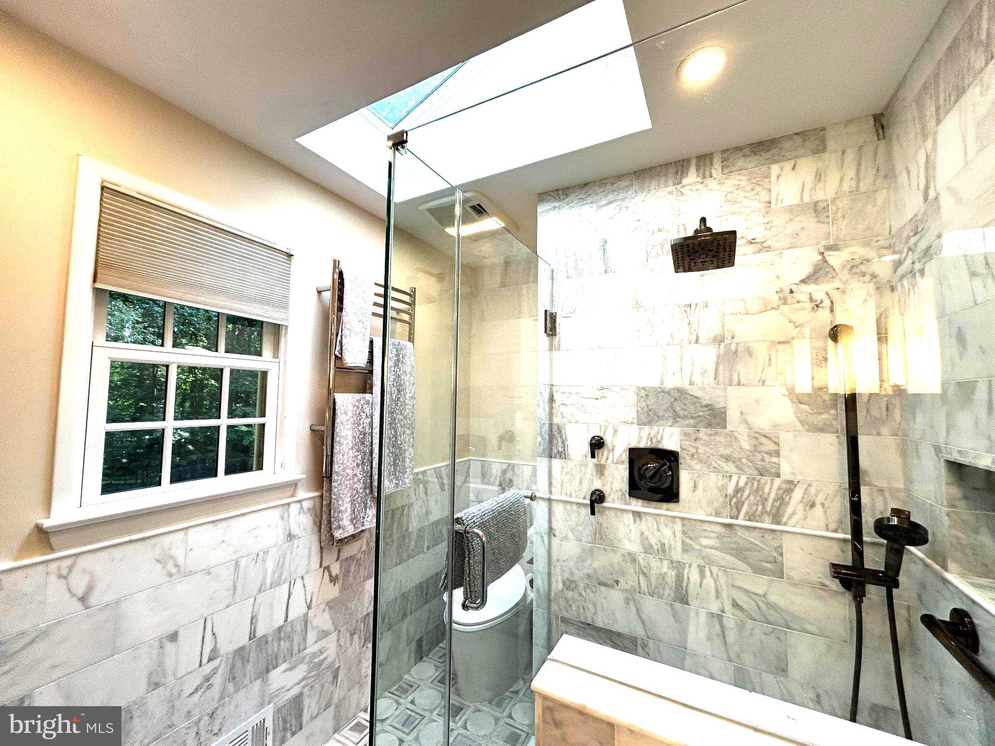 11905 Viewcrest Terrace Silver Spring, MD 20902 - Photo 34 of 68 Elegant marble bath with skylight glow.